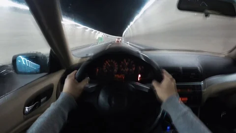 Point of view driving a car on a highway tunnel mountain Hyperlapse Video stock 86529396