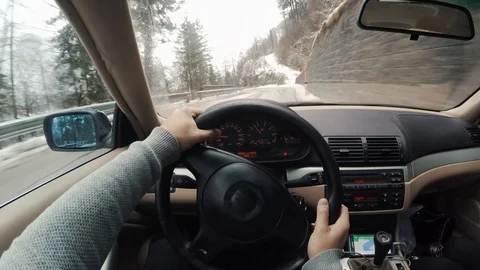 Point of view driving a car mountain road highway winter Stock Footage 86529405