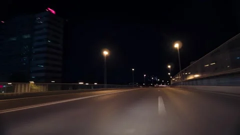 Point of view driving a car through a city centre at night Stock Footage 261381434