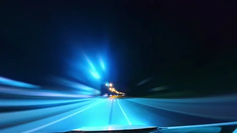 Point of View Driving on the Highway, Illuminated by Blurred Street and Car Stock Footage 257538875