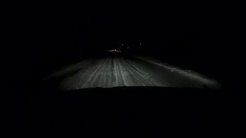 Point of View of Driving in the Snow at Night 스톡 동영상 155115616