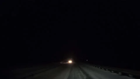 A Point of View of Driving on a Snowy Night With Oncoming Traffic 스톡 동영상 156466672