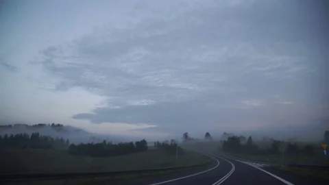 Point of view driving,dashboard camera,on a dark rainy foggy mountain road with Stock Footage 78208791