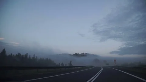 Point of view driving,dashboard camera,on a dark rainy foggy mountain road with Stock Footage 78209060