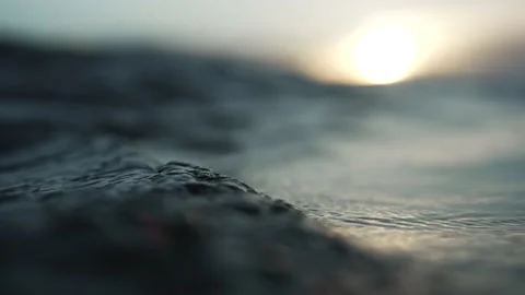 Point of view drowning in dark ocean surface in sunset; shallow depth of Stock Footage 201462649