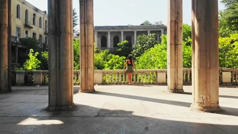 Point of view exploring old historical landmark site surrounded by columns ba Stock Footage 157886030