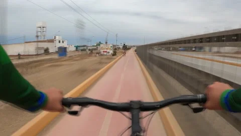 Point of view in fast camera riding a bicycle through the cycle path  Stock Footage 143391123
