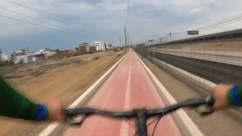 Point of view in fast camera riding a bicycle through the cycle path  Stock Footage 143391195