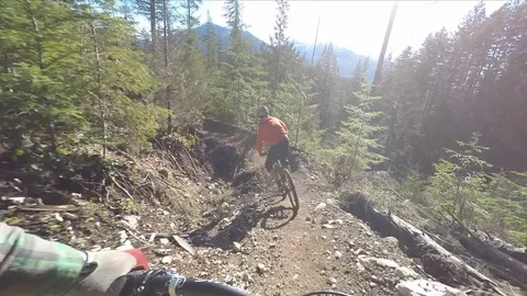 Point Of View Follow Cam Of Professional Mountain Bikers On A Sunny Day Vídeo Stock