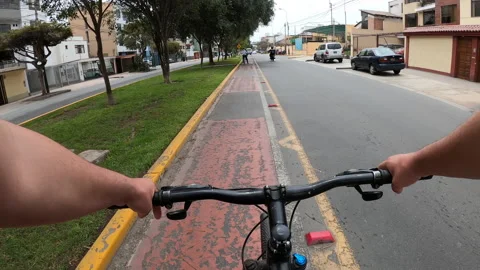 Point of view giving way to cyclists on a narrow bike lane Riding a bike  Stock Footage 141693414
