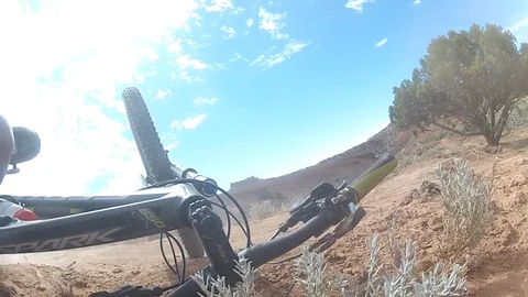 Point-of-view, Go pro of  mountain biking crash on a single-track desert trail. Stock Footage 99471039