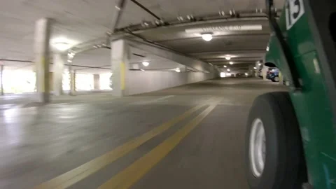 Point of View Golf Cart Driving Through Condominium Garage Stock Footage 200882571