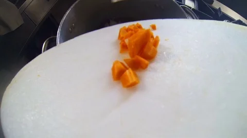 Point of view gopro, pour vegetables into a cooking pot Stock-Footage 76389032