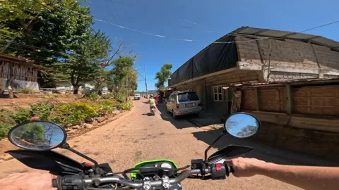Point of view group of friends riding motorbikes on the streets on vacation Stock Footage 283390422