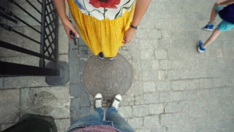 Point Of View. guy stand near well with an old sewerage hatch take photo 스톡 동영상 130569380