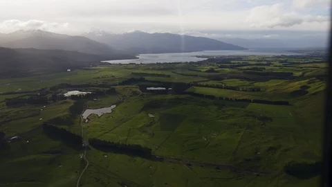 Point of view helicopter flying over South Island Stock Footage 90365479