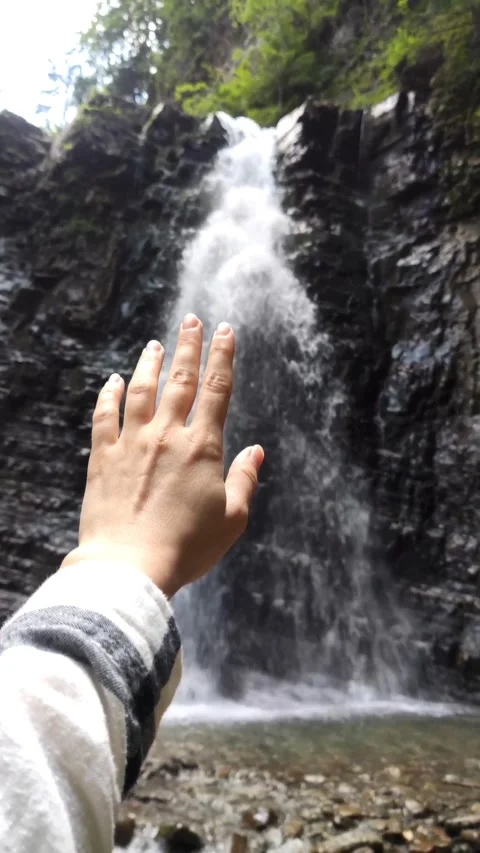 Point of view hiker enjoying view of waterfall Stock Footage 165679299
