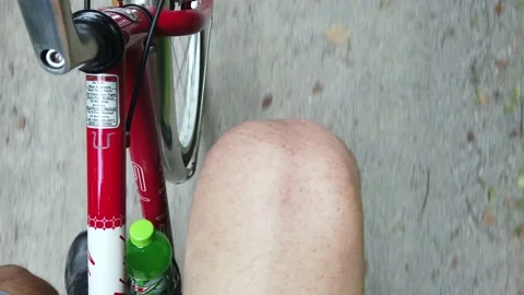 A Point of View of a Humans Knee Riding a Bicycle Stock-Footage 157878911