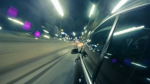 Point of view hyperlapse of a car driving on a city street at night Stock Footage 92036118