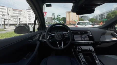 Point of view from inside an autonomous vehicle navigating through city traffic Stock Footage 336990350