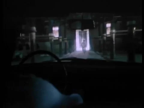 Point of view from inside car of gangsters pursing man on motorcycle Stock Footage 260249417