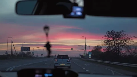 A point-of-view from inside a moving car, looking through windshield Stock Footage 346472080