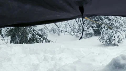 Point Of View From Inside Snowy Tarp Shelter Winter Blizzard Stock Footage 336497381