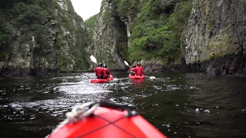 Point of View Kayaking between Tall Mountains. Stock Footage 199221704