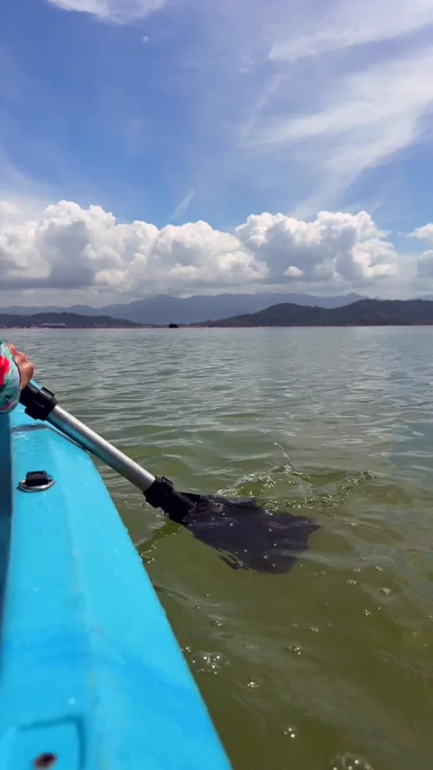 Point of view kayaking on calm sea with paddle stroke, active travel moment Stock Footage 337104506