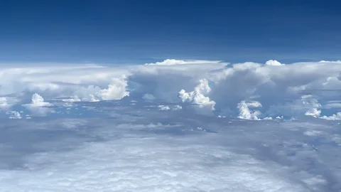 Point of view looking out a jet airplane window at amazing clouds. Vídeo Stock 104581629