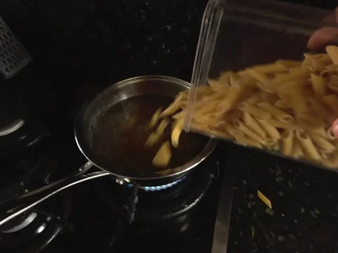 Point of view of male hands stirring short spaghetti Stock Footage 319947266