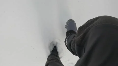 Point of view of a male Walking Through the thick snow blanket Stock-Footage 230121153