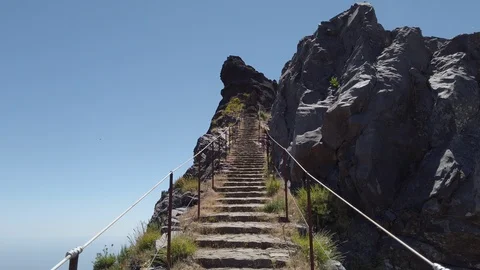 Point of view of a man climbing stone stairs in Pico Areeiro, Madeira island in Stock Footage 114815279