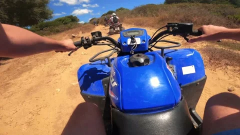 Point of view man driving ATV on off-road Stock Footage 158799386