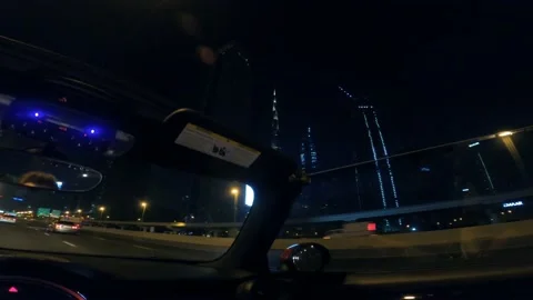 Point of view man driving a convertible car in Dubai city street at night Video stock 194796035