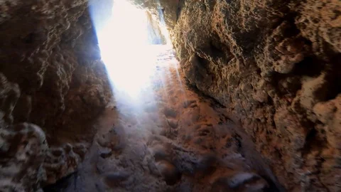 Point of view man exploring wild cave reveal shot of Tres Irmaos beach Stock Footage 117349186