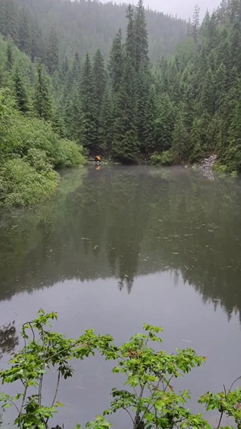 Point of view man hiker stand at the lake beach in carpathian mountains Stock Footage 170563641