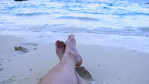 Point of view man legs laying on the beach sea waves on background Stock Footage 169012049
