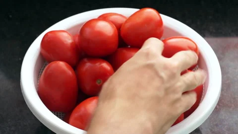 Point of view of a man picking tomatoes for cooking. Stock Footage 156768799