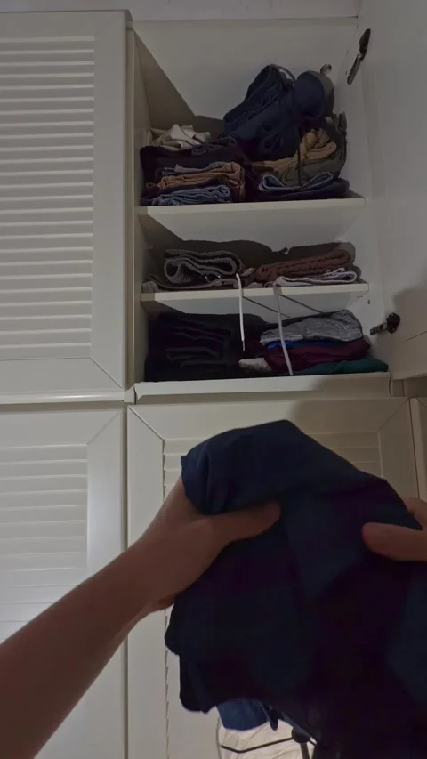 Point of view of man putting clothes in wardrobe Stock Footage 340430784