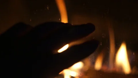 Point Of View Man Rubbing Hands in front of Burning Fireplace POV warming cold Stock Footage 114005466