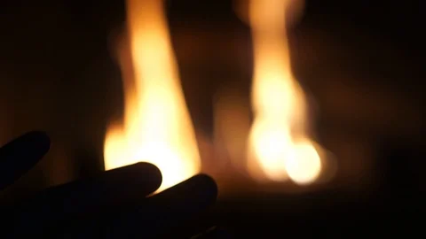 Point Of View Man Rubbing Hands in front of Burning Fireplace POV warming cold Stock Footage 114005558