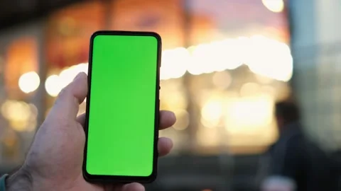 Point of View of man at street Using Phone With Green Mock-up Screen Chroma Key Video stock 167961791