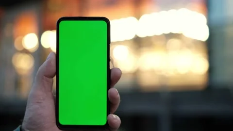 Point of View of man at street Using Phone With Green Mock-up Screen Chroma Key Video stock 168722457