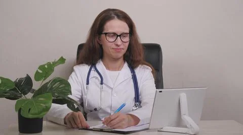 Point of View: Man Using Smartphone to Talk to His Doctor via Video Conference 写真素材