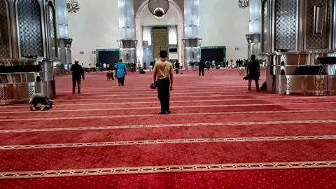 Point of view of a man walking into the Istiqlal Mosque area to pray, Stock Footage 289922038