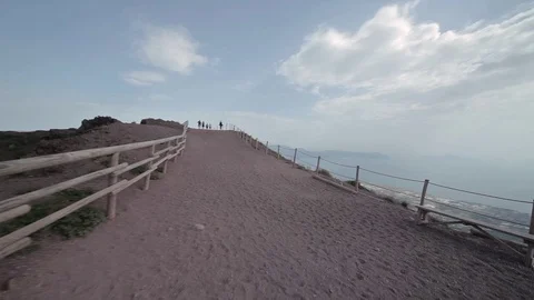 Point of view of a man walking on the path around Mount Vesuvius, Italy Stock Footage 73379653