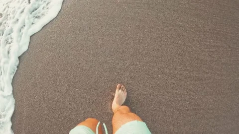 Point of view of man walking on the sand at the beach enjoying and having fun 库存影片 221877096