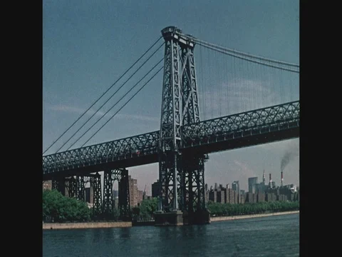 Point of view, medium shot, passing the Williamsburg Bridge from the East River Video stock 82547233