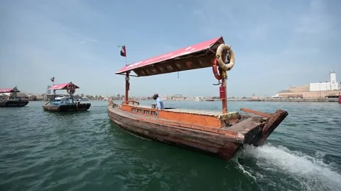 Point Of View Of Men Riding Nautical Vessels In Sea By City - Dubai, United Arab Stock Footage 222572337